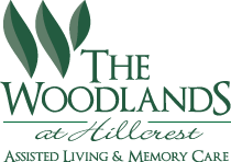 Logo of The Woodlands at Hillcrest, Assisted Living, Memory Care, Lincoln, NE